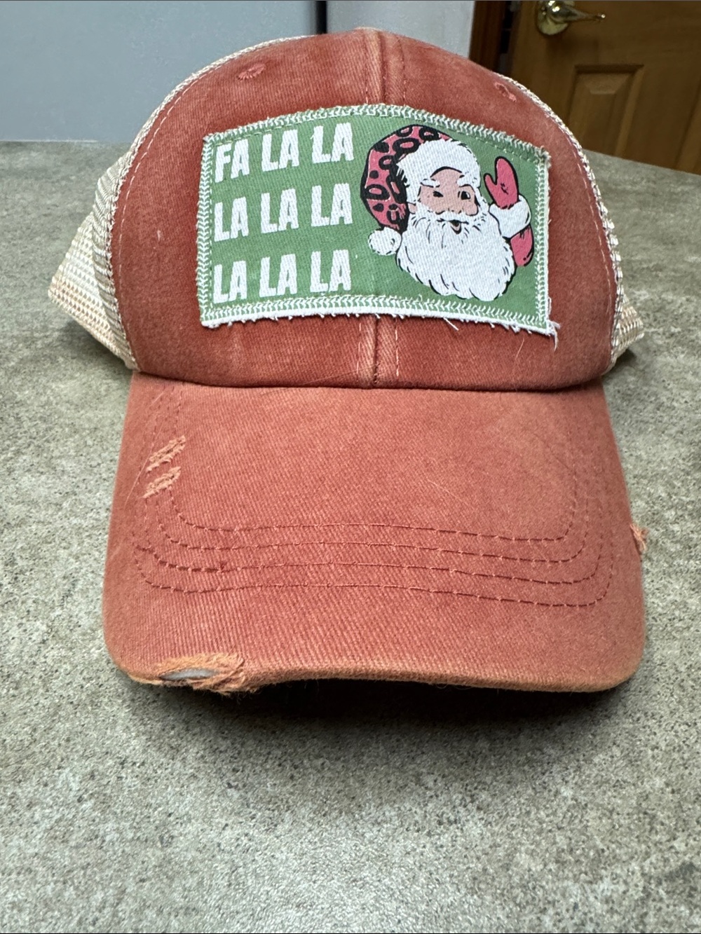 Plunder Christmas Rust Red Santa 'Fa La La' Mesh Back Distressed Holiday Cap Hat